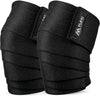 Pair of black Flexi Muscles knee wraps for weightlifting rolled around the knee shape