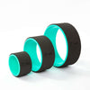 Yoga wheel set by Flexi Muscles, three black and turquoise wheels in small, medium and large